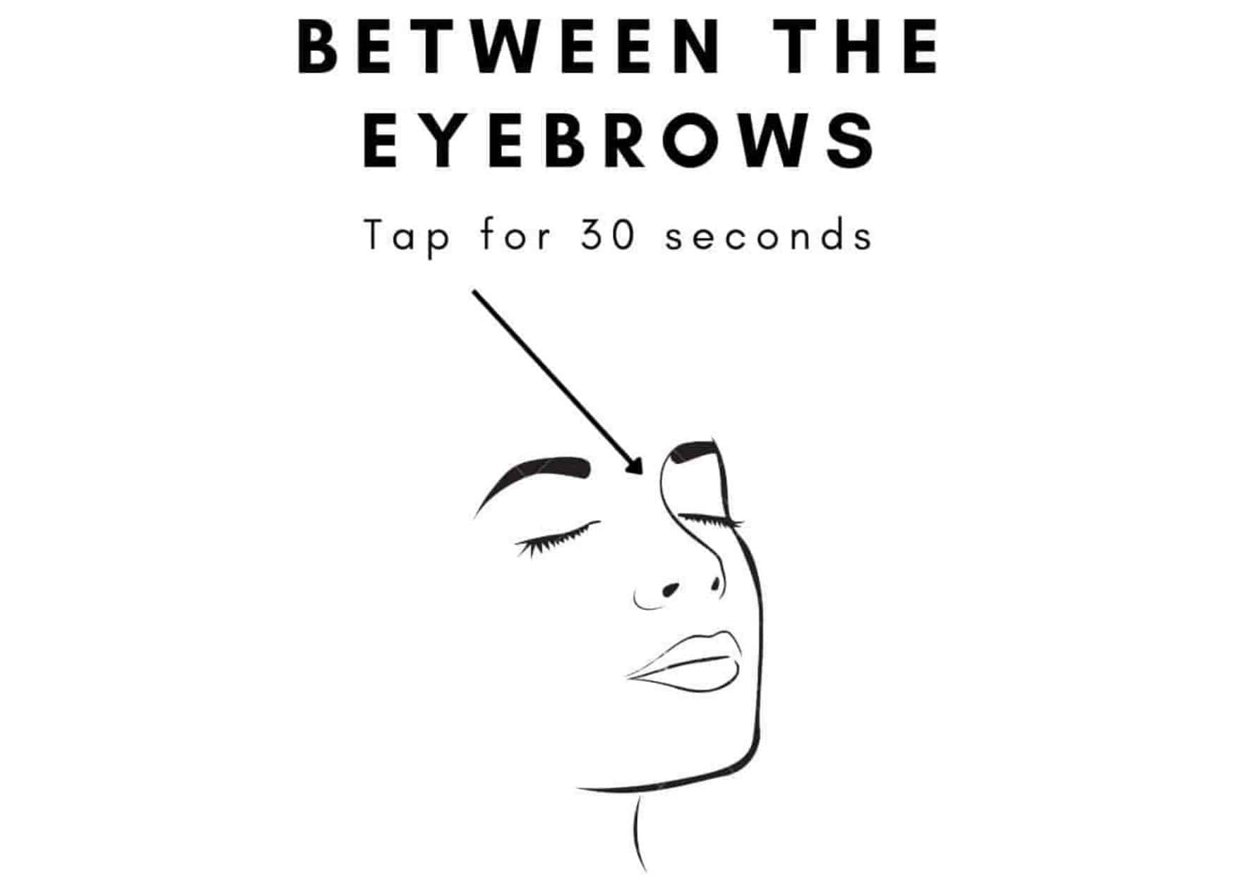 tapping between the eyebrows